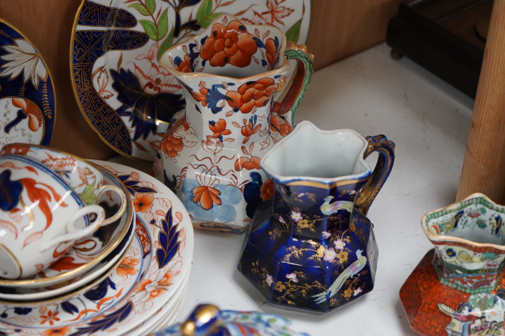 A collection of 19th century English ironstone china to include two pairs of sauce tureens, covers and stands, one marked Masons, various side plates and teacups